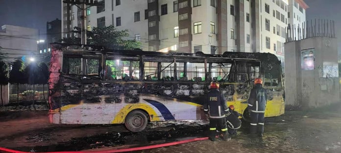 আশুলিয়ায় দুর্বৃত্তদের আগুনে পার্কিং করা বাস পুড়ে ছাই